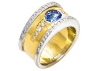 Round Brilliant Tanzanite with round brilliant diamonds as accents - set in Platinum