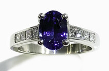 Ceylonese Sapphire with princess cut diamonds set in Platinum